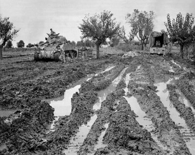 Sherman tank and a lorry in muddy terrain, Italy, c.1943-45, from a collection of 650 photographs compiled by the Commando Association by American Photographer